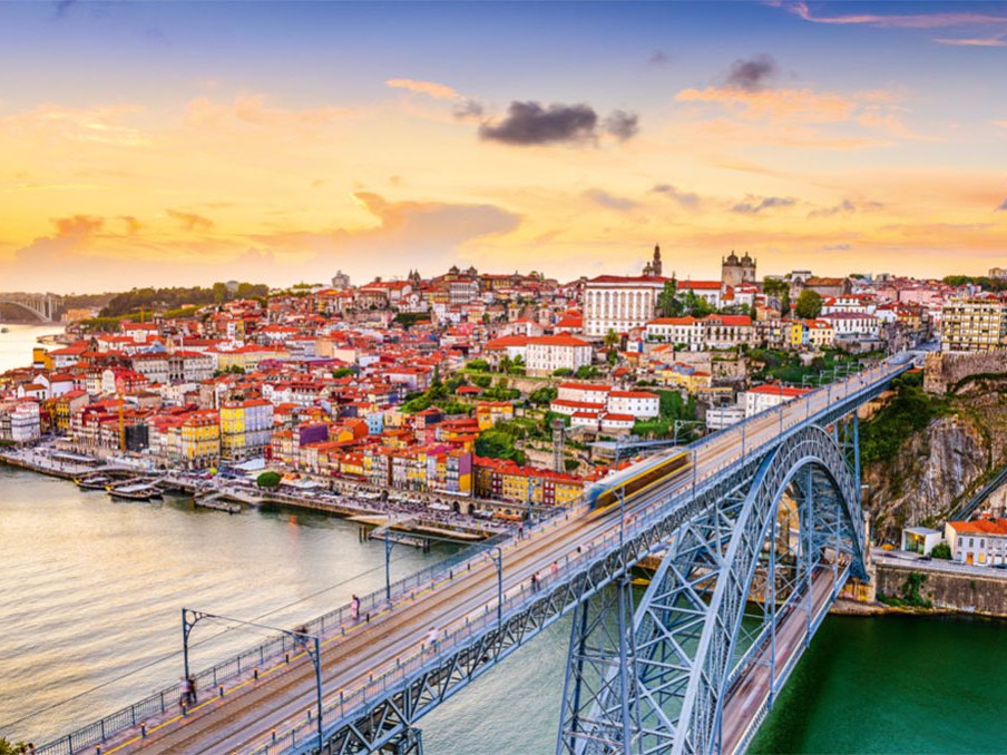Porto at sunset, with the Dom Luís I bridge over the Douro