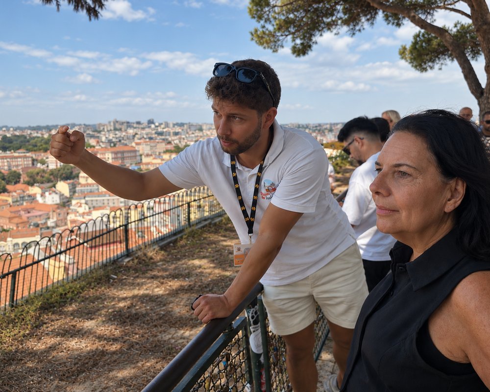An I Took a Tuk Tuk guide pointing out the city to a guest from a Lisbon miradouro